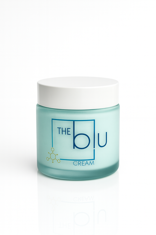 A light blue frosted glass jar with a white lid labeled The Blu Cream - Zinc, Copper, and Magnesium in blue text, featuring a molecular graphic, contains this mineral cream to soothe damaged skin. Displayed on a white background.