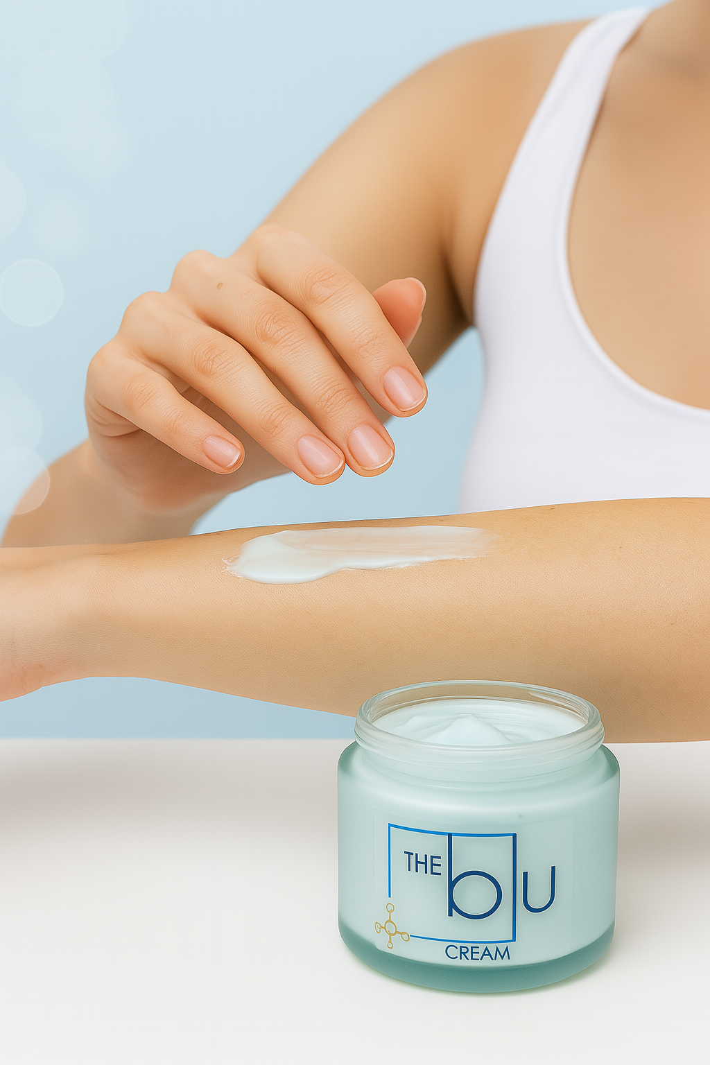 A person in a white tank top applies The Blu Cream - Zinc, Copper, and Magnesium to their forearm; the open jar is on the table, formulated to soothe damaged skin.